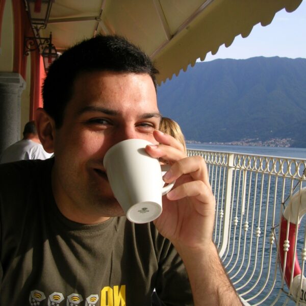 Business Coach Jacob Aldridge drinking coffee at Lake Como